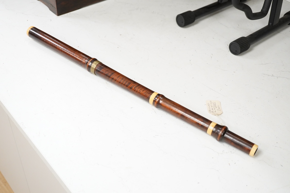 A 19th century crocus wood and ivory flute possibly by Metzler, six holes and one key to the foot joint, 60.5cm long, ivory submission ref: HMMH3U4M